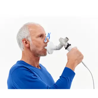 Patient breathing into Vyaire's Vyntus SPIRO PC Spirometer pulmonary function testing device.